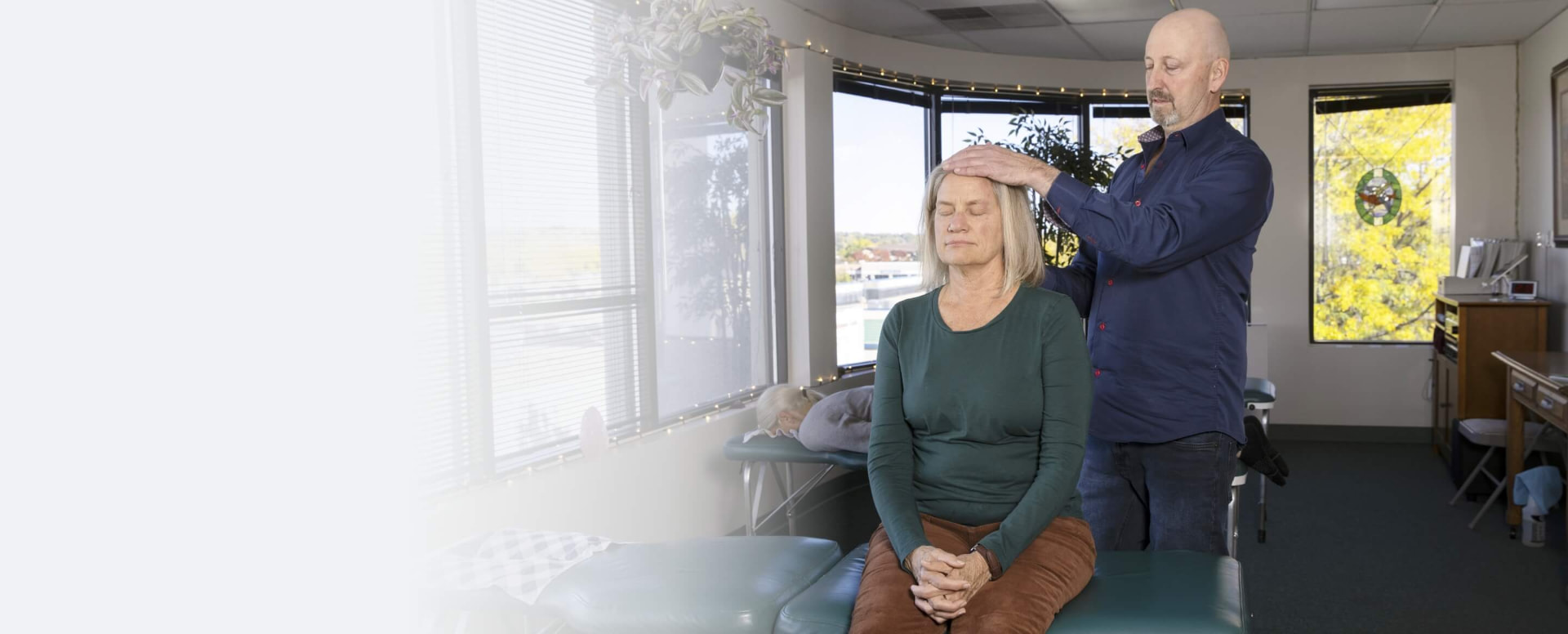 Dr. Rick Munn providing gentle, whole-person care in his Lakewood office.